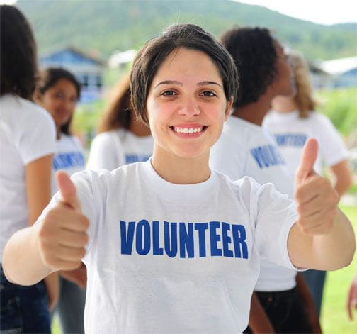 Young girl with group of volunteers