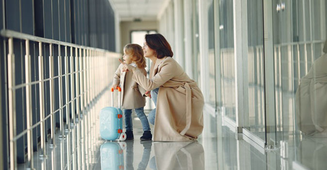 child and parent at the airport