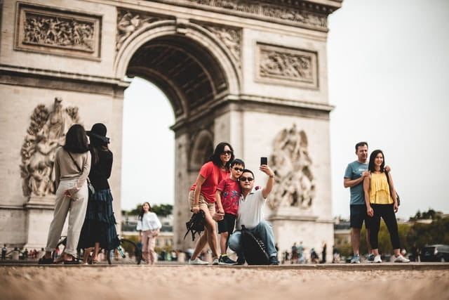 family taking pictures in paris after a canceled flight