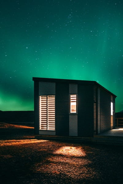 tiny house under northern lights