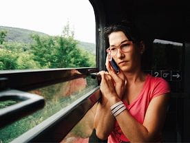 woman on phone on train 