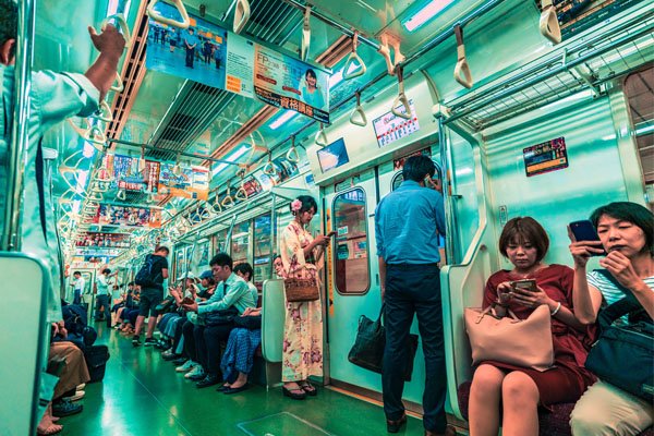people-riding-train-in-tokyo-japan