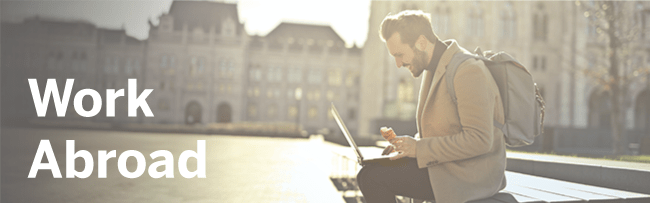 work-abroad-image-of-man-with-laptop