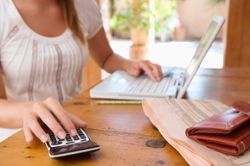 woman paying bills on laptop