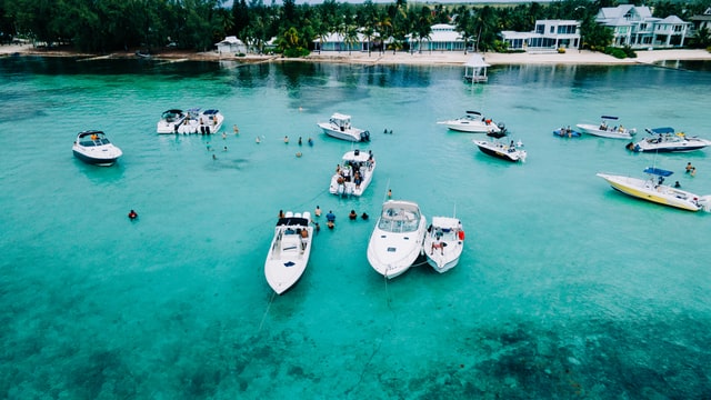 boats sitting in the water in the cayman islands