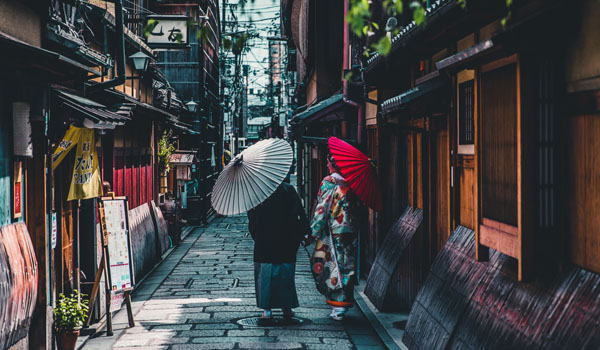 women-walking-down-street-in-kyoto-japan