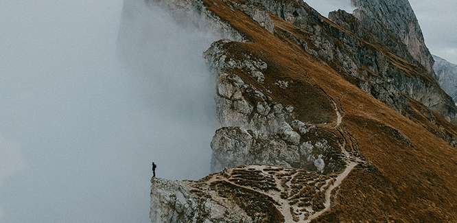 image of a person standing on top of a mountain