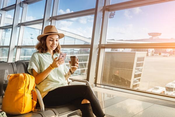 asian-girl-waiting-for-departure-at-the-airport-on-your
