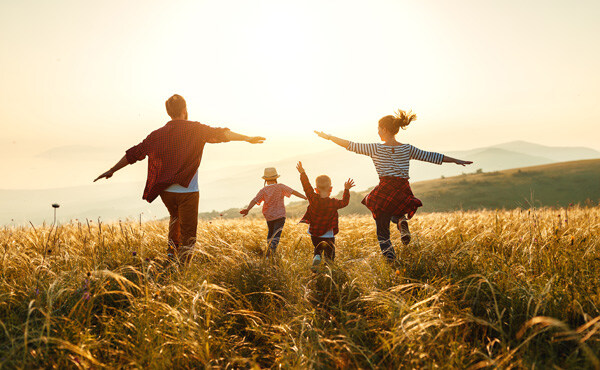 happy-family--mother--father--children-son-and-daughter-on-nature