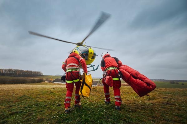 two-paramedic-with-safety-harness-and-climbing-equipment-running-to