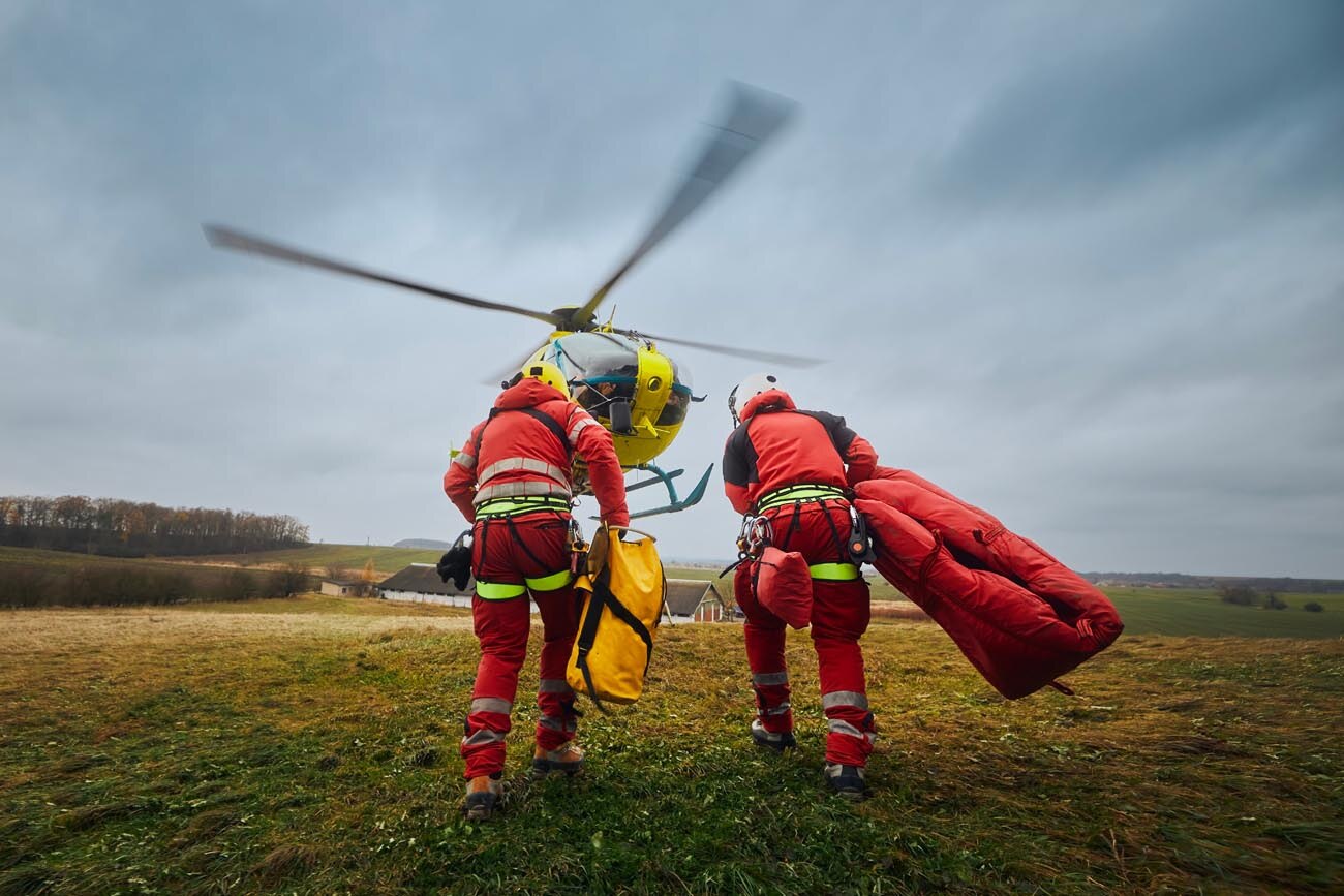 two-paramedic-with-safety-harness-and-climbing-equipment-running-to