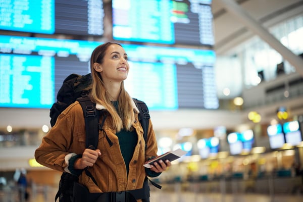 travel--airport-and-excited-woman-with-passport-1