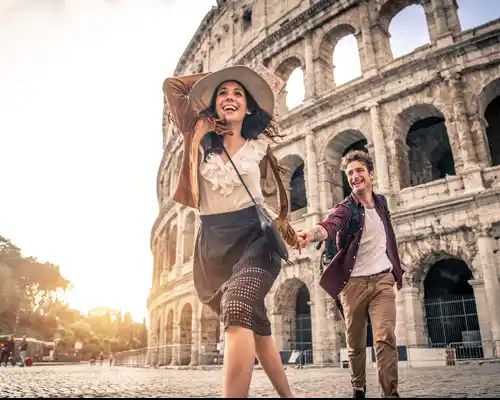 travel-insurance-for-a-young-couple-at-the-colosseum--rome---happy-tourists-visiting