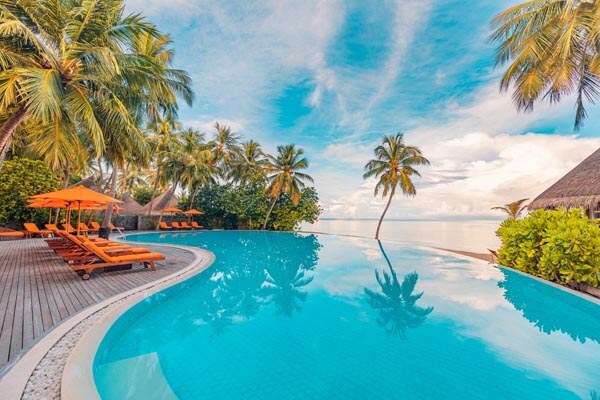 stunning-landscape--swimming-pool-blue-sky-with-clouds-Tropical-Resort