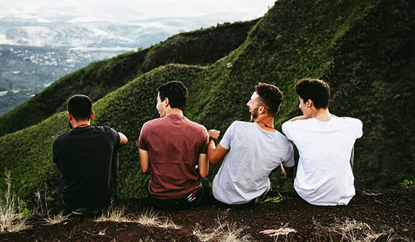 group-of-college-age-missionaries-sitting-on-a-cliff.jpg